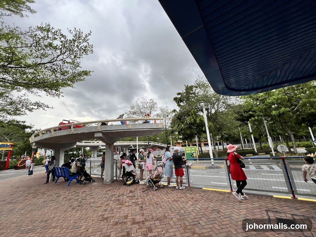 People waiting at an outdoor attraction