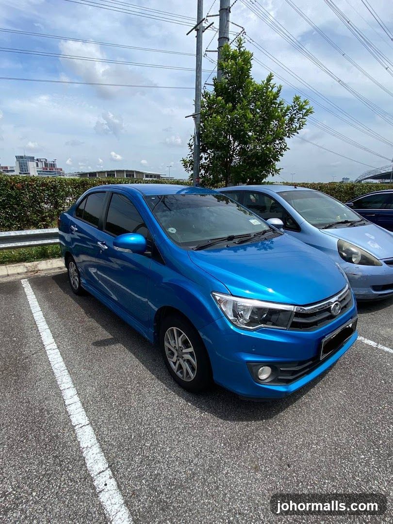 Blue Sedan in Parking Lot