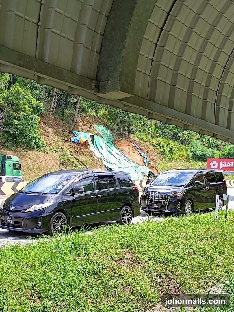 Cars parked near a landslide