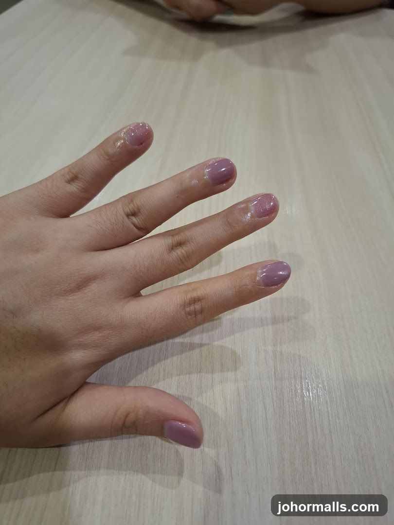 Hand with freshly painted nails