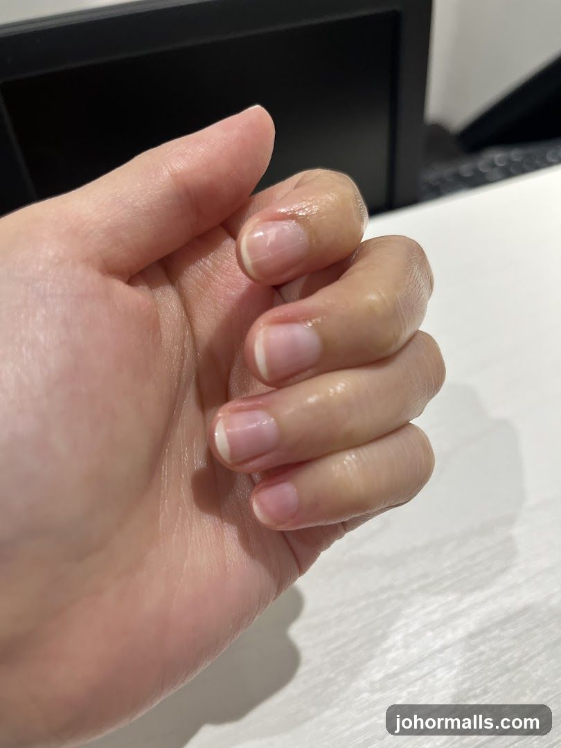 Close-up of a hand with French manicure