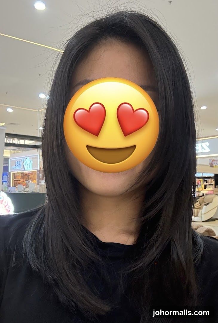Woman with heart eyes emoji covering face