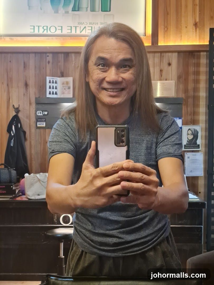 Man taking a selfie in a salon
