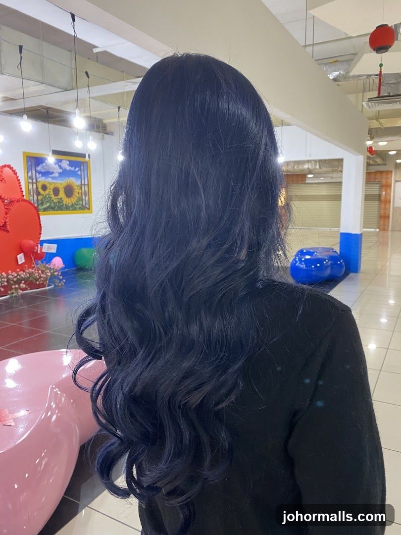 Woman with dark blue wavy hair