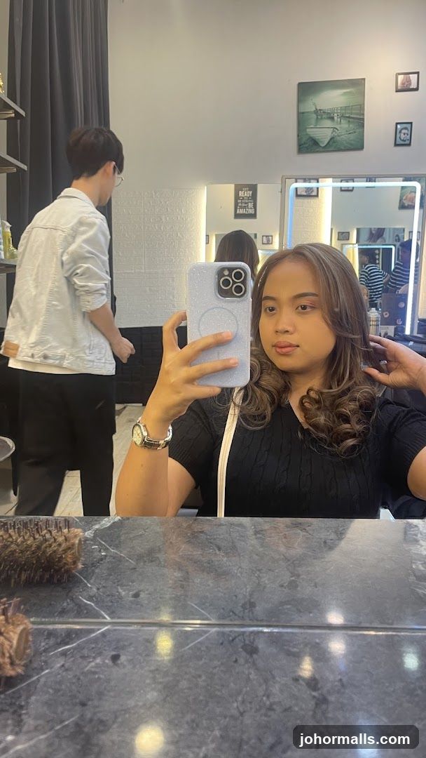 Woman taking a selfie in a salon