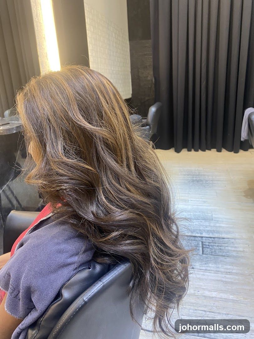 Woman with highlighted hair in salon