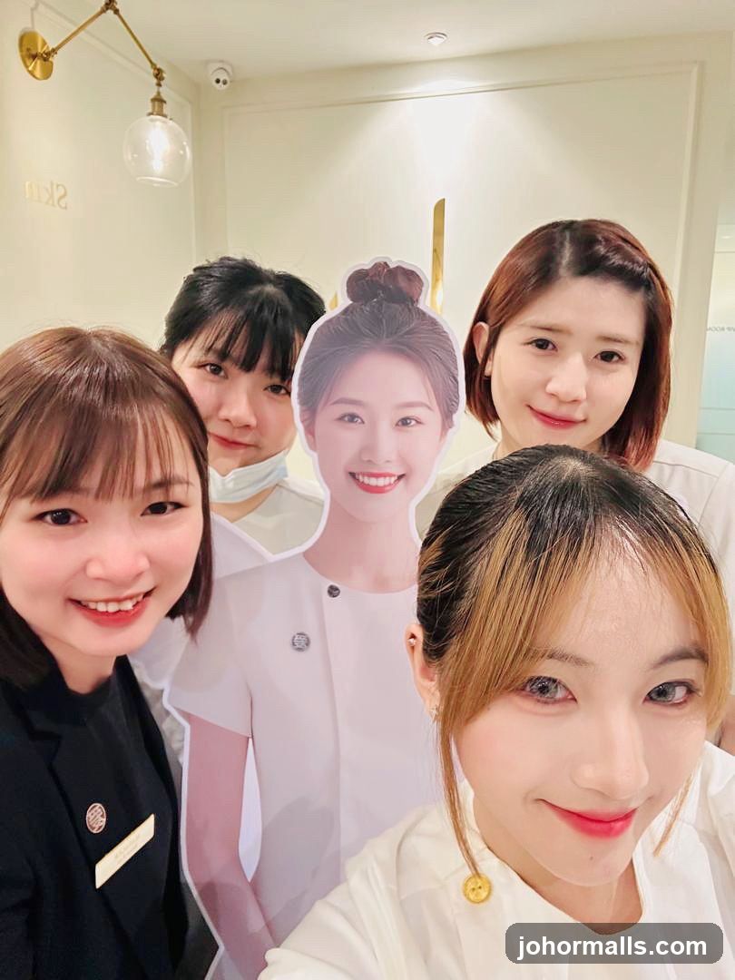 Staff Posing with Cardboard Cutout