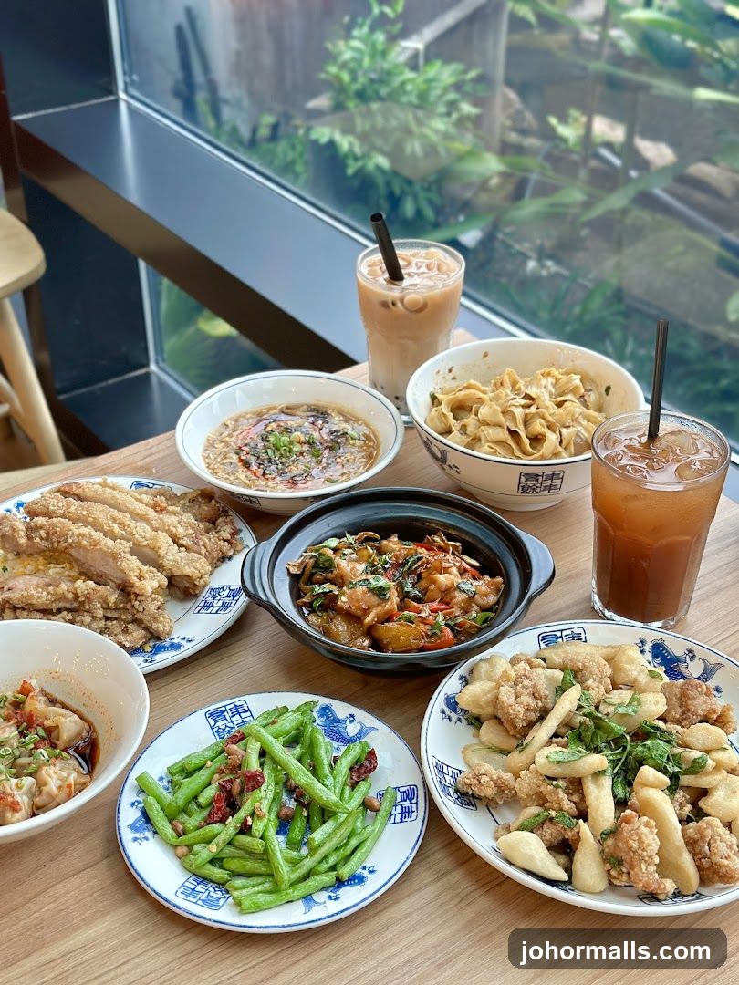 Table with various Asian dishes and drinks