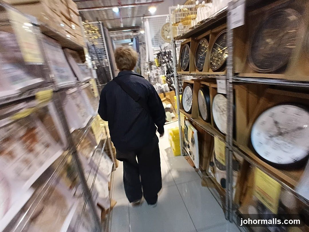Store aisle with clocks and framed items