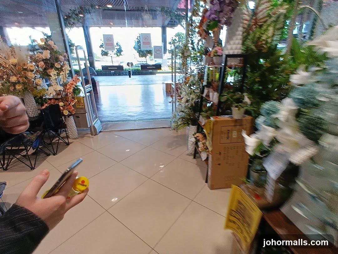 Store Entrance with Artificial Flowers