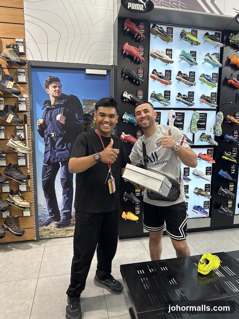 Store Employees and Customer with Shoe Box