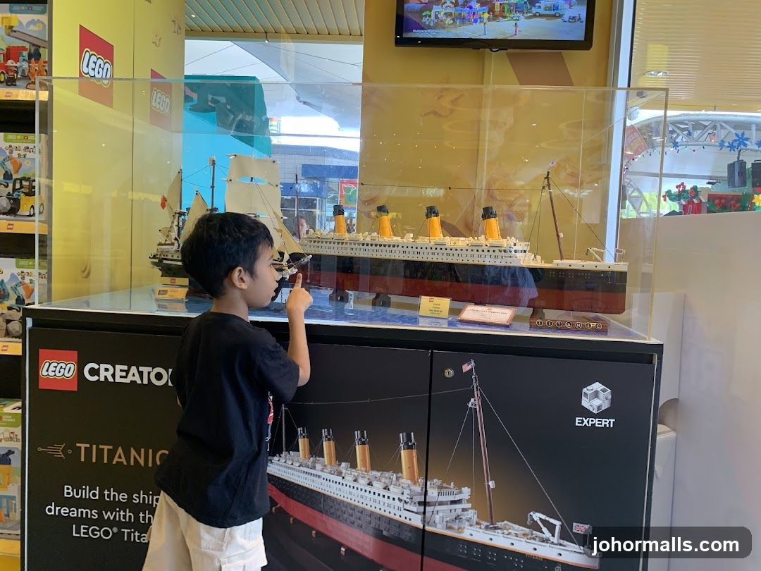 Boy looking at Lego Titanic model