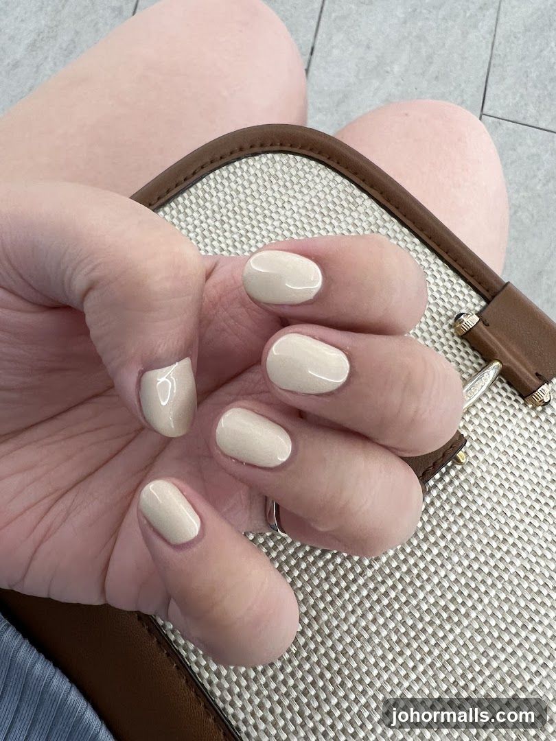 Woman's Hands with Light Beige Nails
