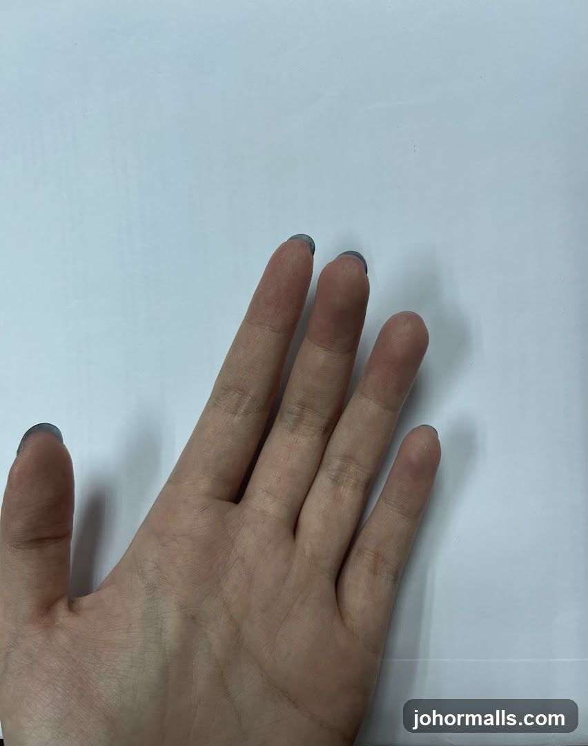 Hand with dark nail polish