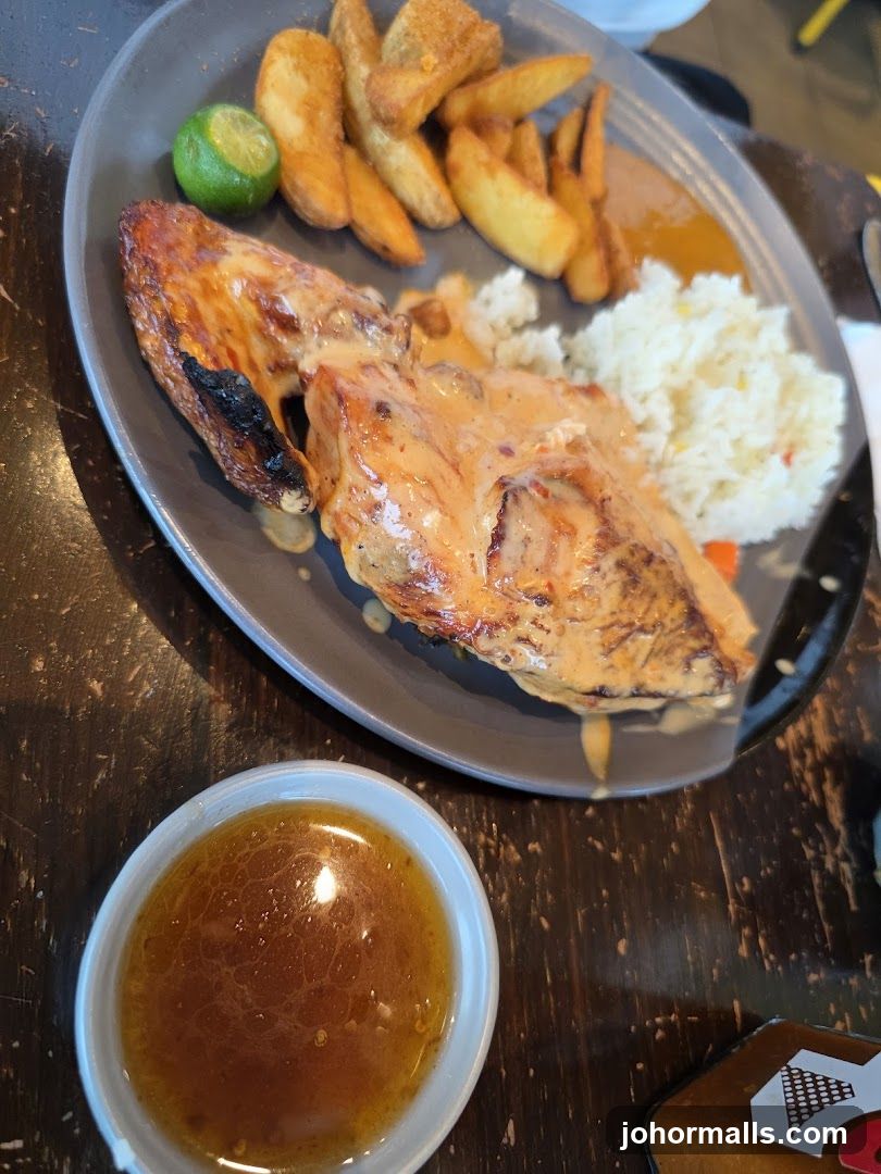 Chicken with Sauce, Rice, and Fries