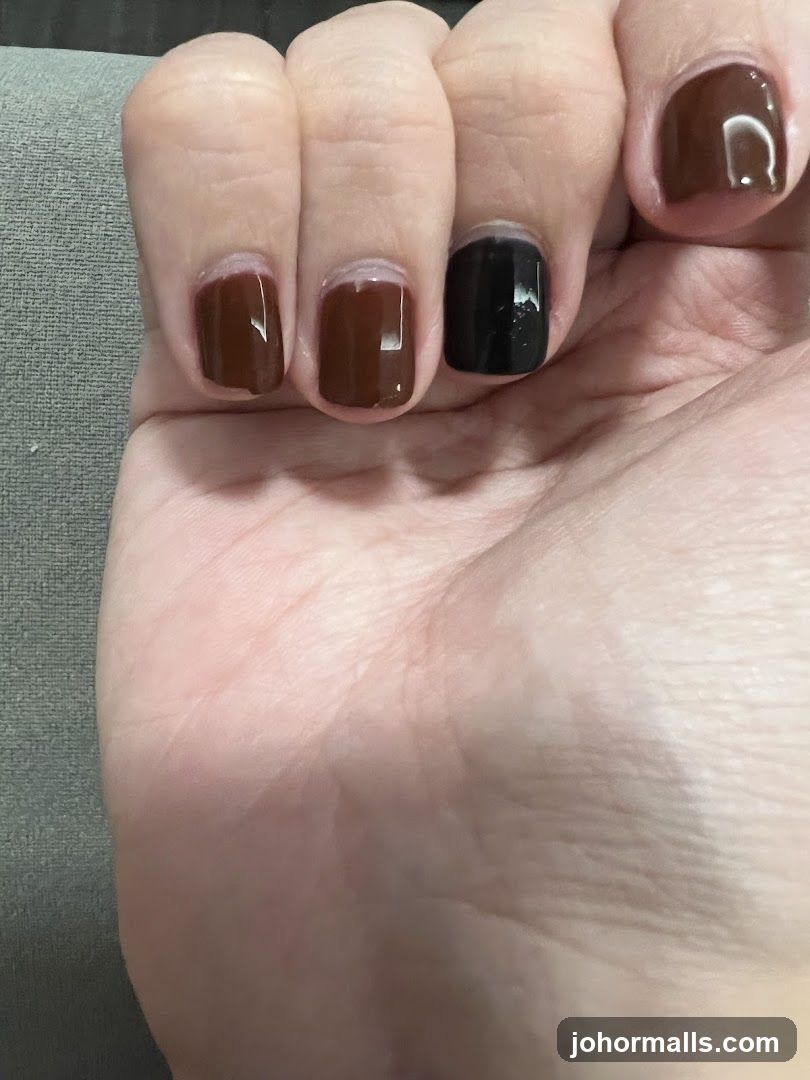 Nails with brown and black polish
