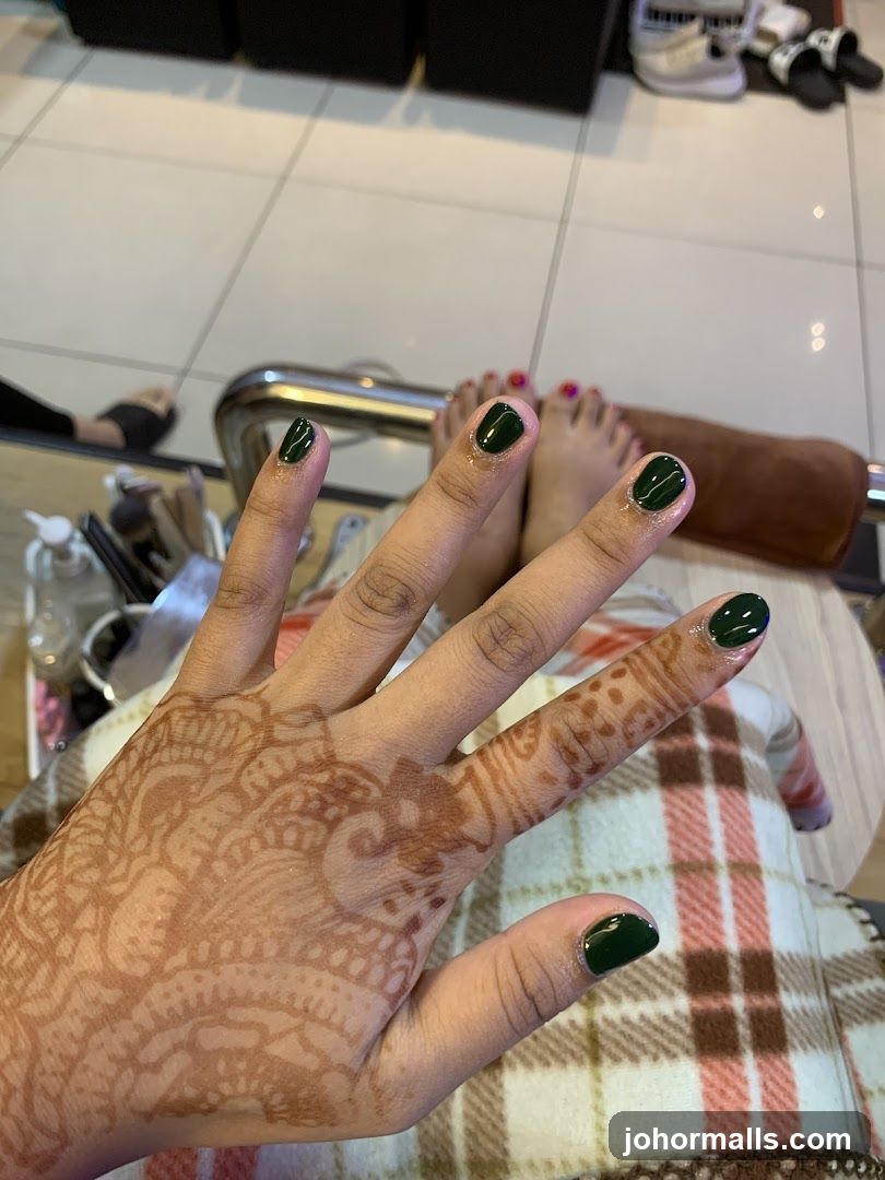 Henna Hand and Green Nails