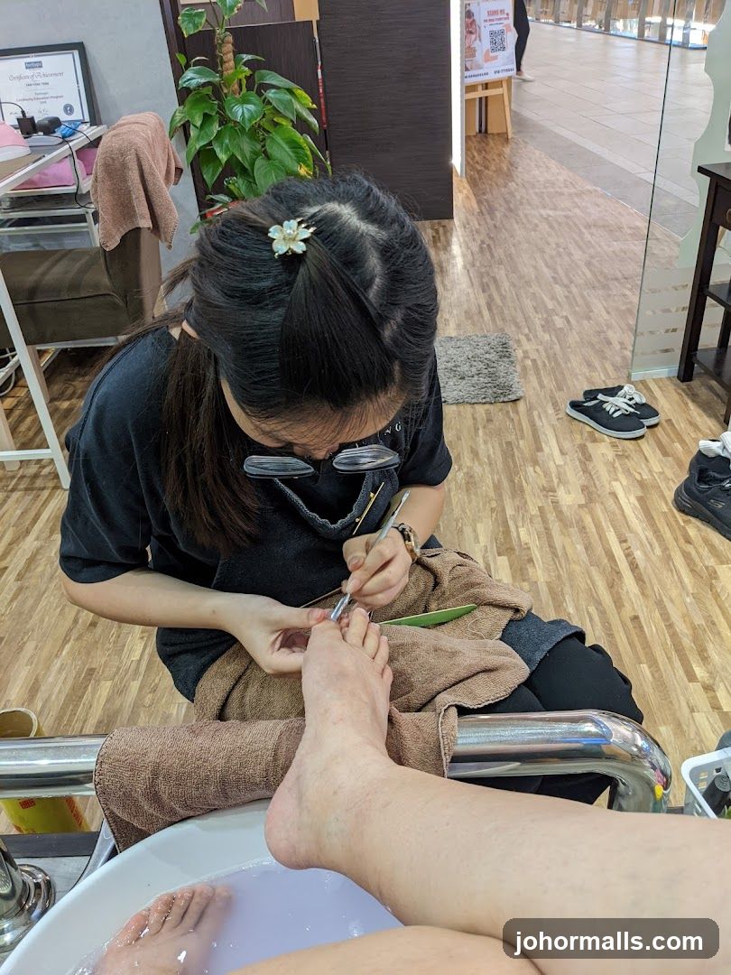 Nail Technician Performing Pedicure