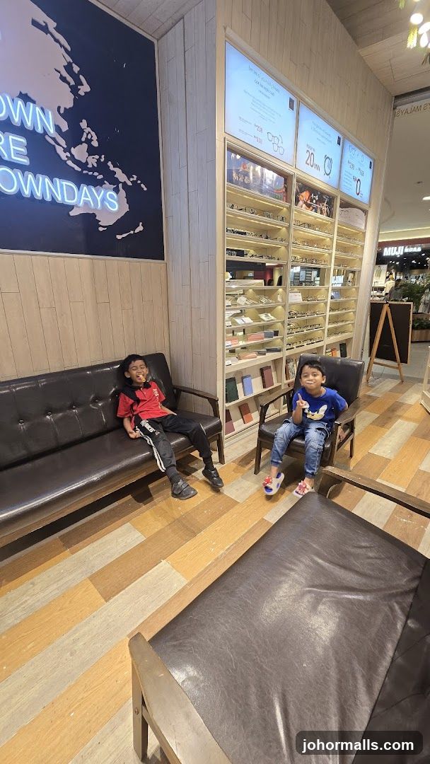 Two boys sitting in a store