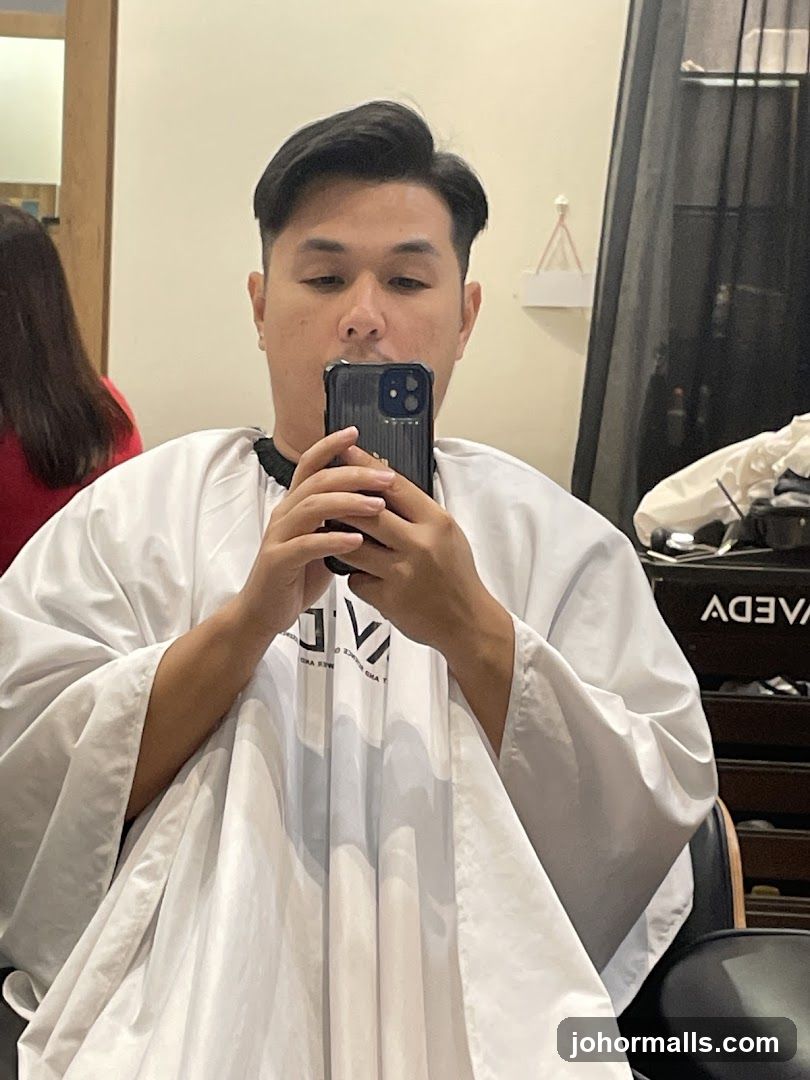 Man Taking Selfie in Hair Salon