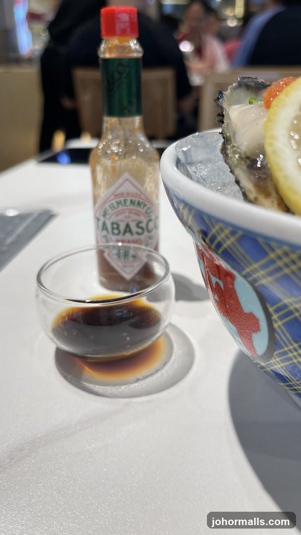 Tabasco bottle and oyster