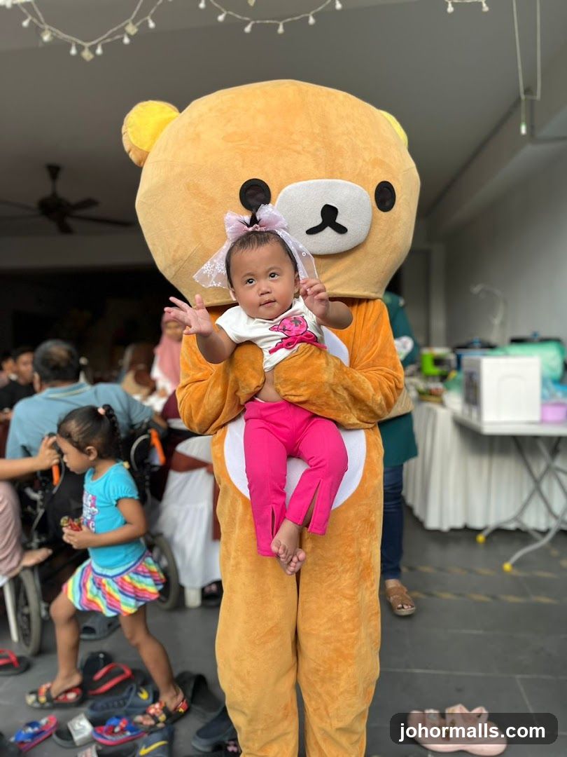 Person in Bear Costume Holding a Baby