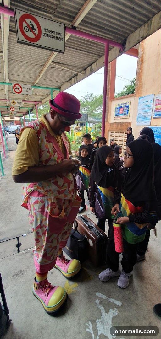 Clown interacting with children