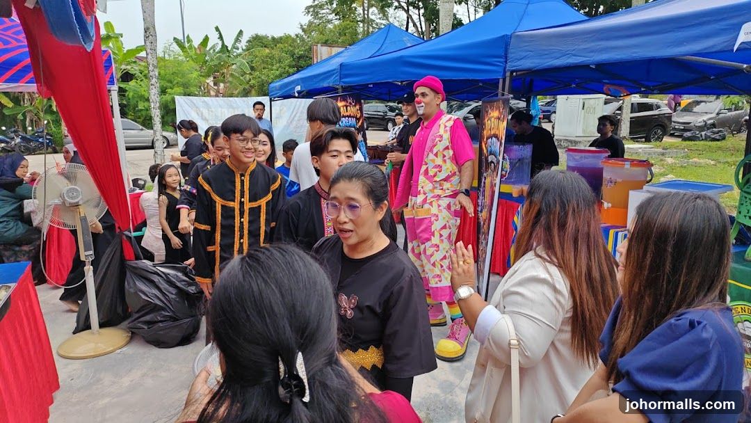 Outdoor event with performers and attendees