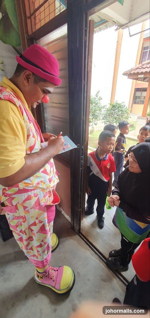 Clown interacting with children