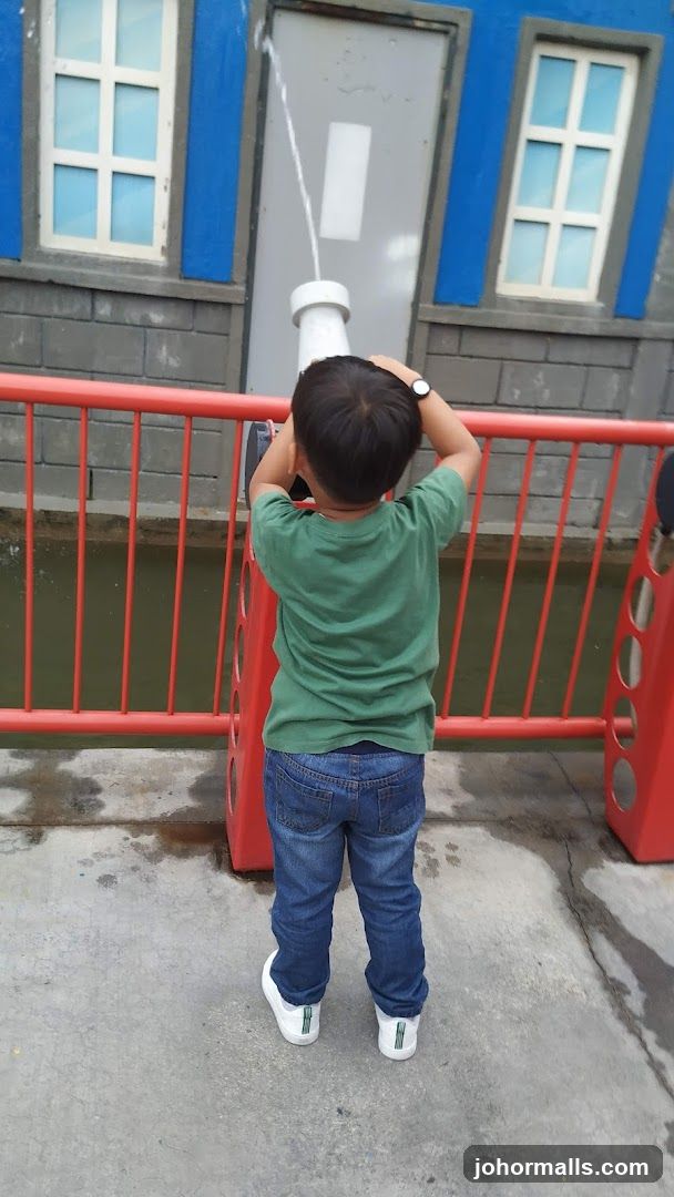 Child playing with water gun
