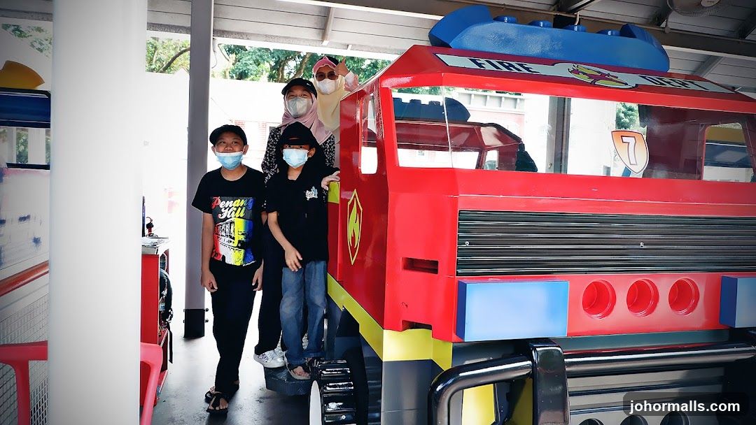 Children and Adults Posing with a Fire Truck Replica