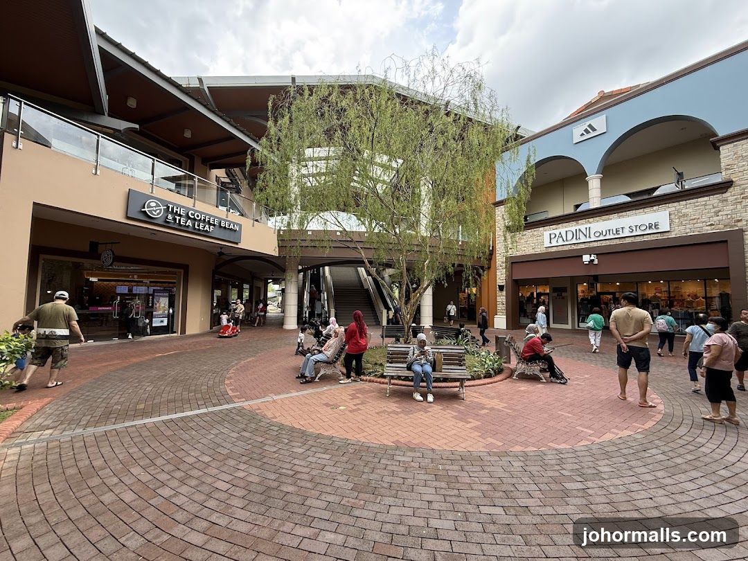Outdoor shopping area with various stores
