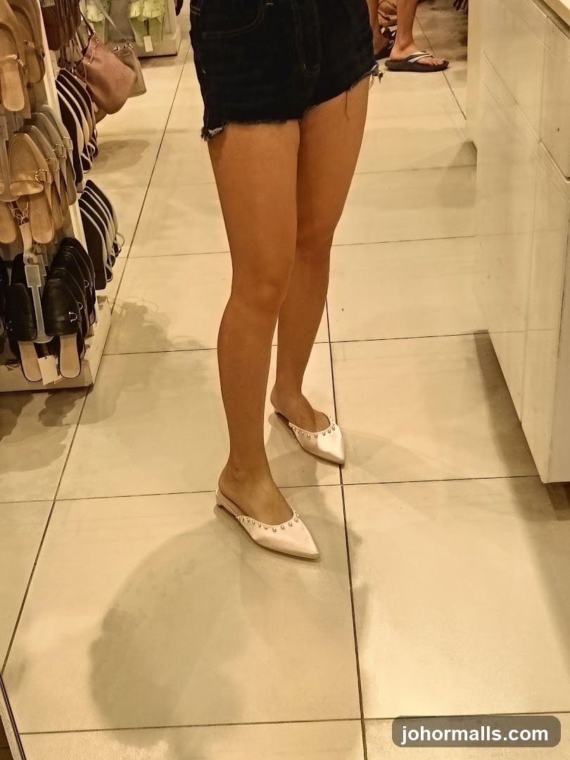 Woman Wearing Studded Mules in a Store