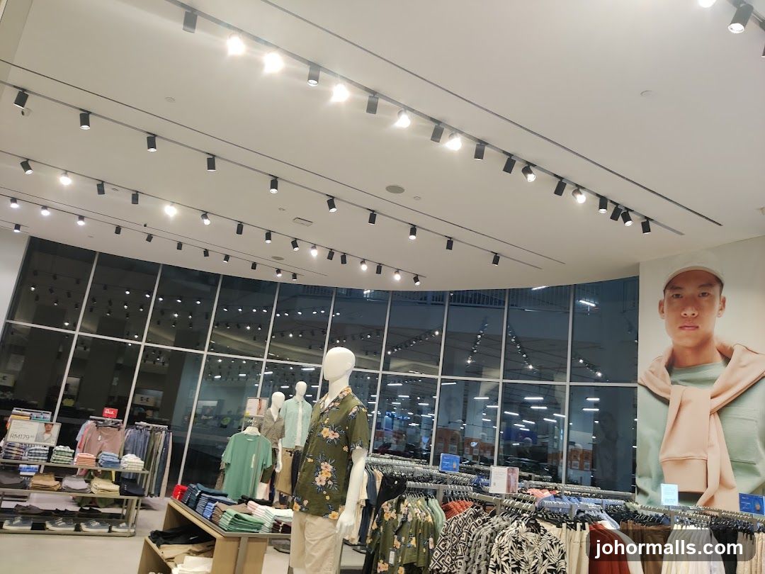 Clothing store interior with mannequins and apparel