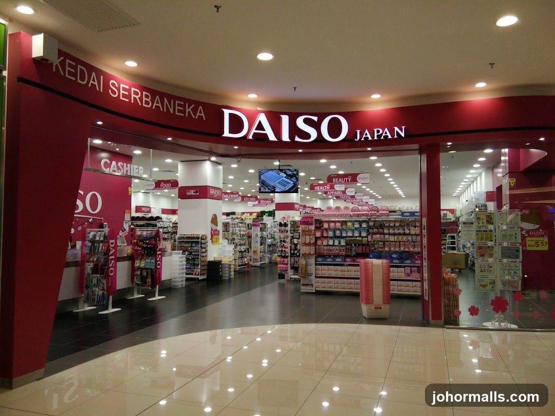 The exterior of a Daiso Japan store, a general merchandise store. The store has a large red facade with the