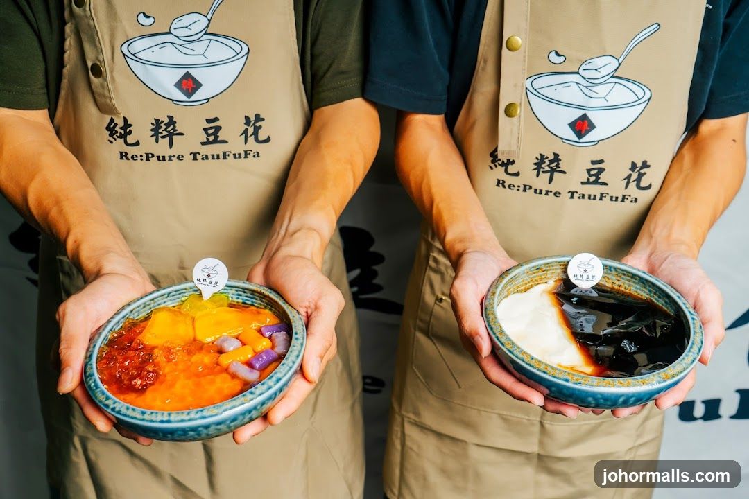 Two people holding bowls of dessert