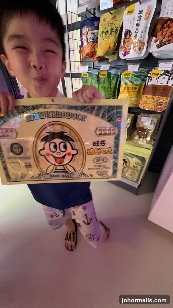 Boy Holding Snack Packaging