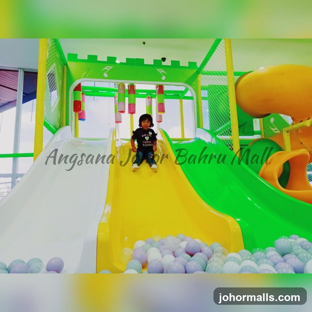 Indoor Playground with Child on Slide
