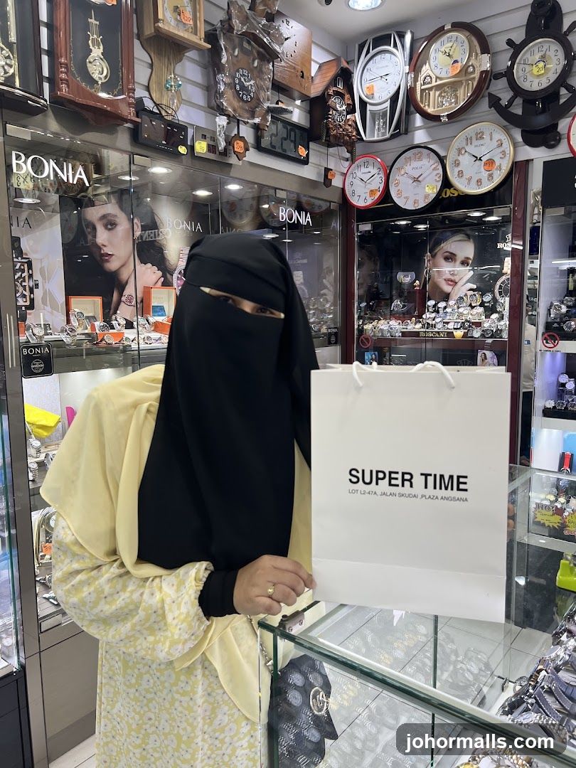 Woman holding a shopping bag in a watch store