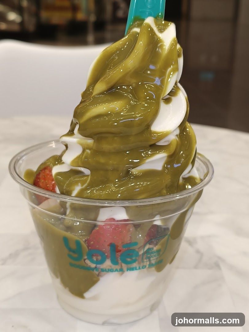 Yolé Frozen Yogurt with Matcha Drizzle and Strawberries
