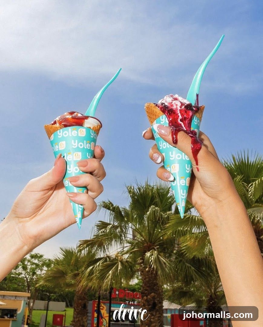 Two ice cream cones with toppings