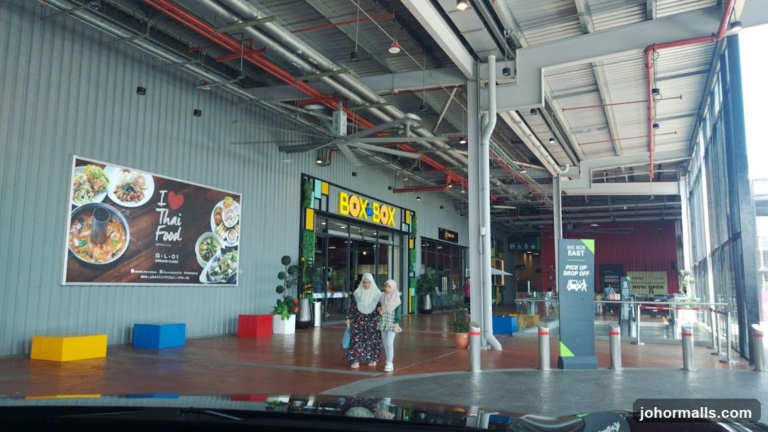 Outdoor shopping area with food and retail establishments