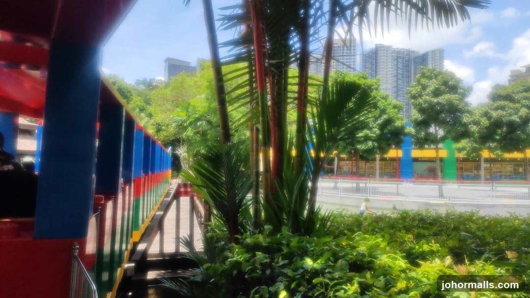 Colorful Train Ride in a Tropical Setting