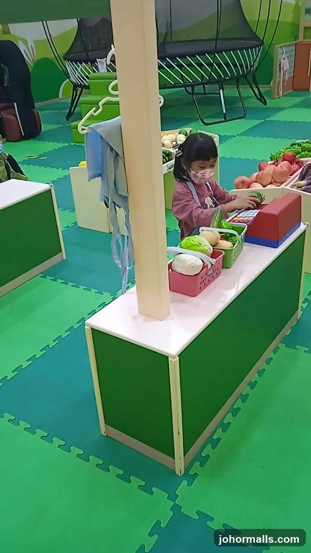 Child playing at a pretend market stall