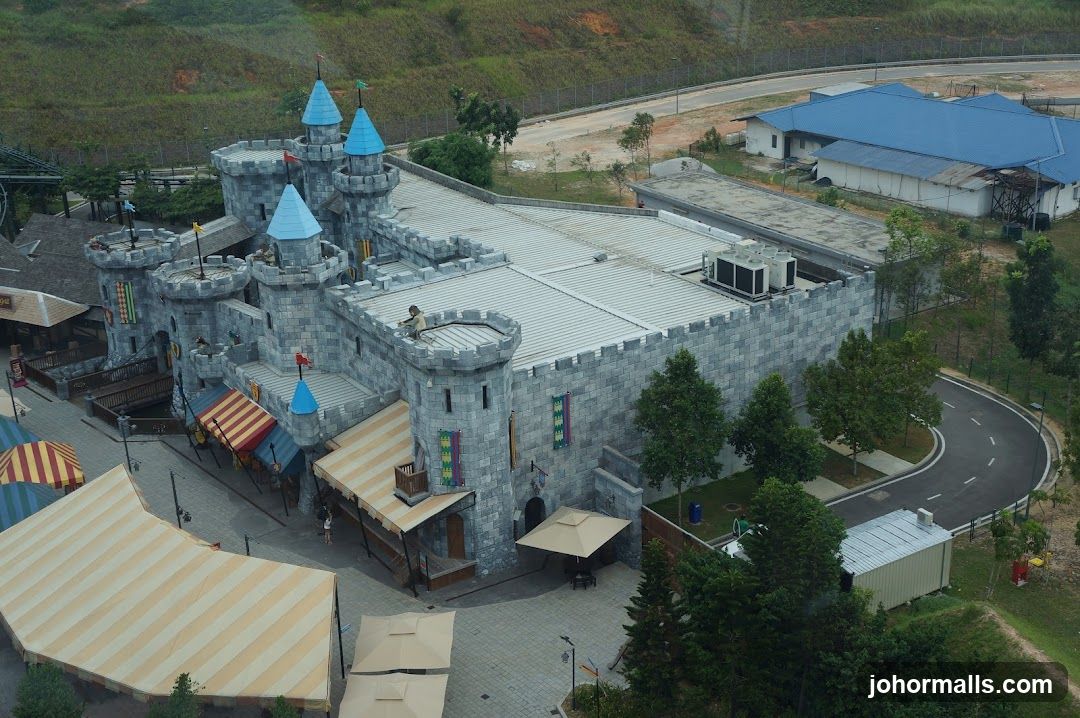 Castle-themed building with awnings and tents