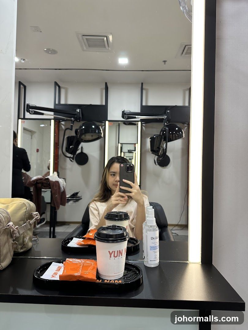 Woman taking a selfie in a salon