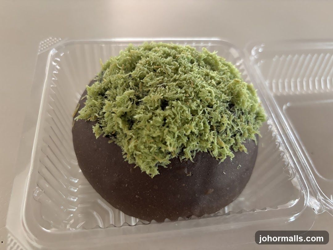 Chocolate pastry with green topping
