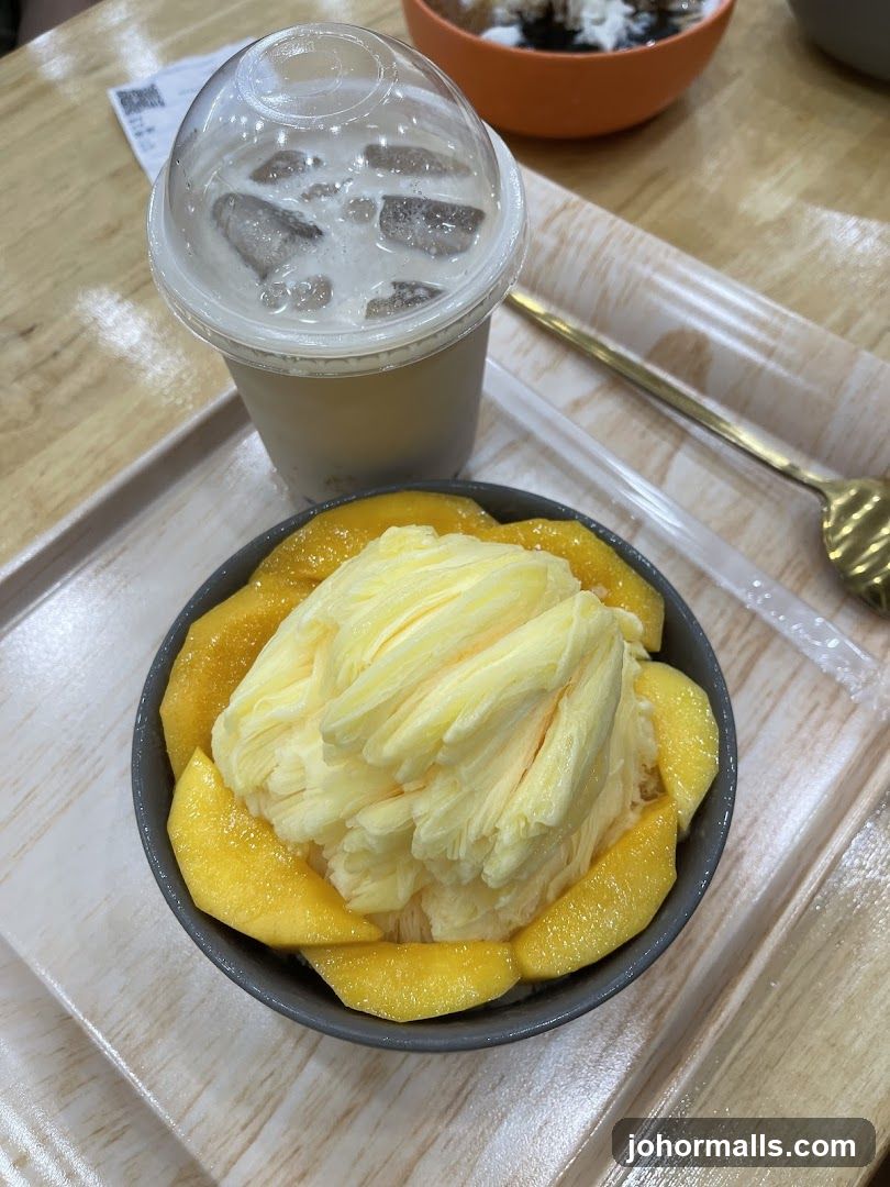 Mango shaved ice with a drink