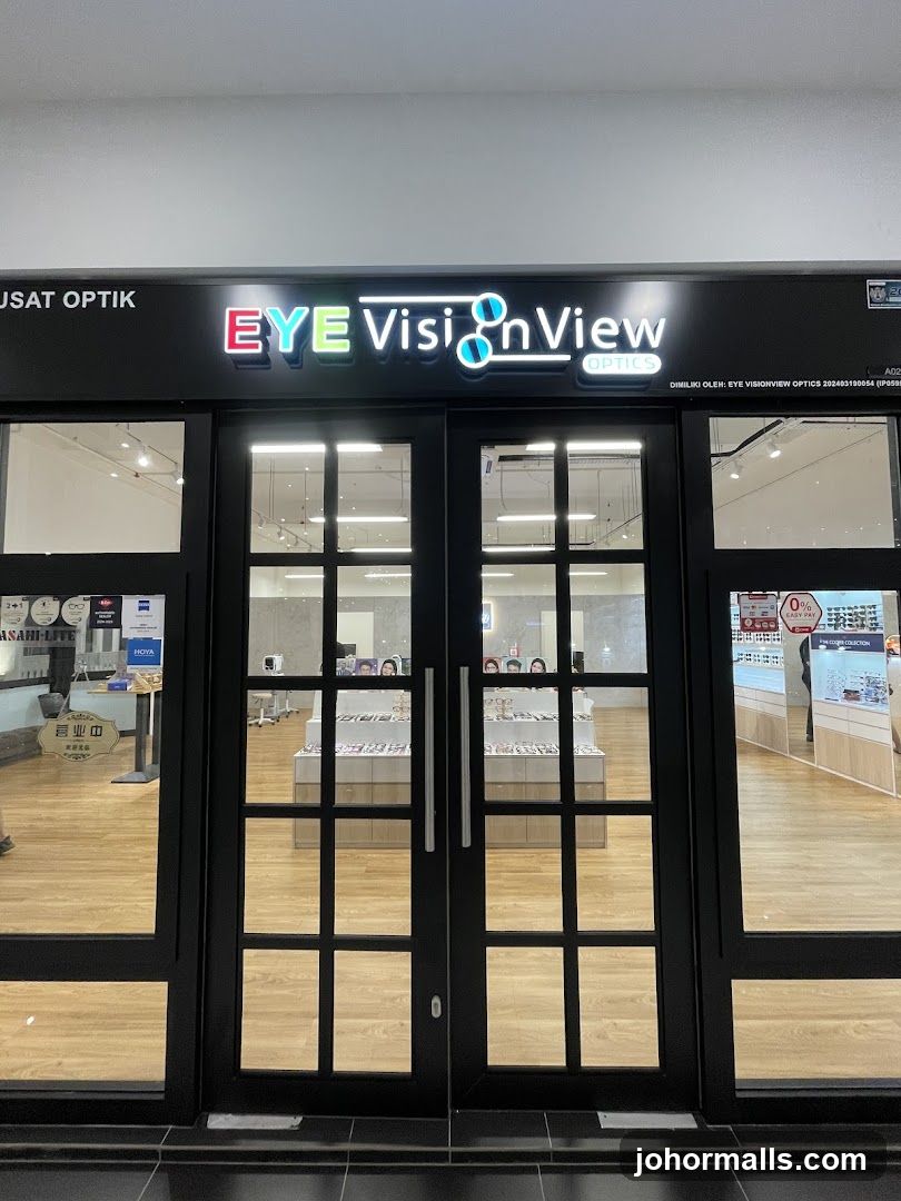 The storefront of an optical shop with a large sign that reads "EYE VisionView OPTICS". The entrance has double glass doors with a grid pattern. Inside, displays of eyeglasses are visible.