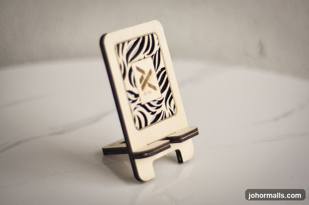 Wooden phone stand with laser-cut design